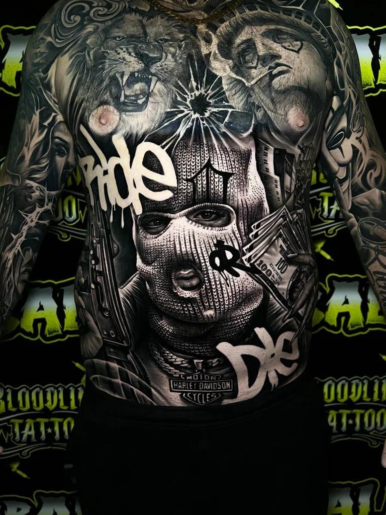 Detailed black and grey Chicano full back tattoo with a ski mask portrait, lion head, Statue of Liberty, cash stacks, and rifle at Bloodline Tattoo Bali.