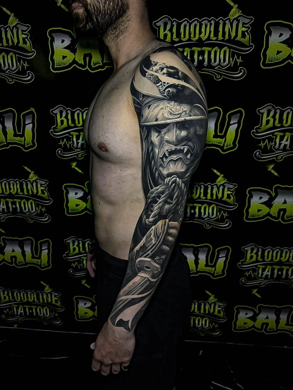 Healed Japanese sleeve with a Hannya mask, rope braid, and katana elements, showing settled blacks and sharp healed line integrity at Bloodline Tattoo Bali.